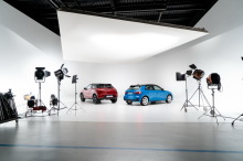 DS3 Crossback Performance Line Ruby Red and Audi A1 Sportback 2019 Blue Turbo Rear view in studio on white background