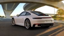 Porsche logo painted black and lettering 911 Carrera S removed