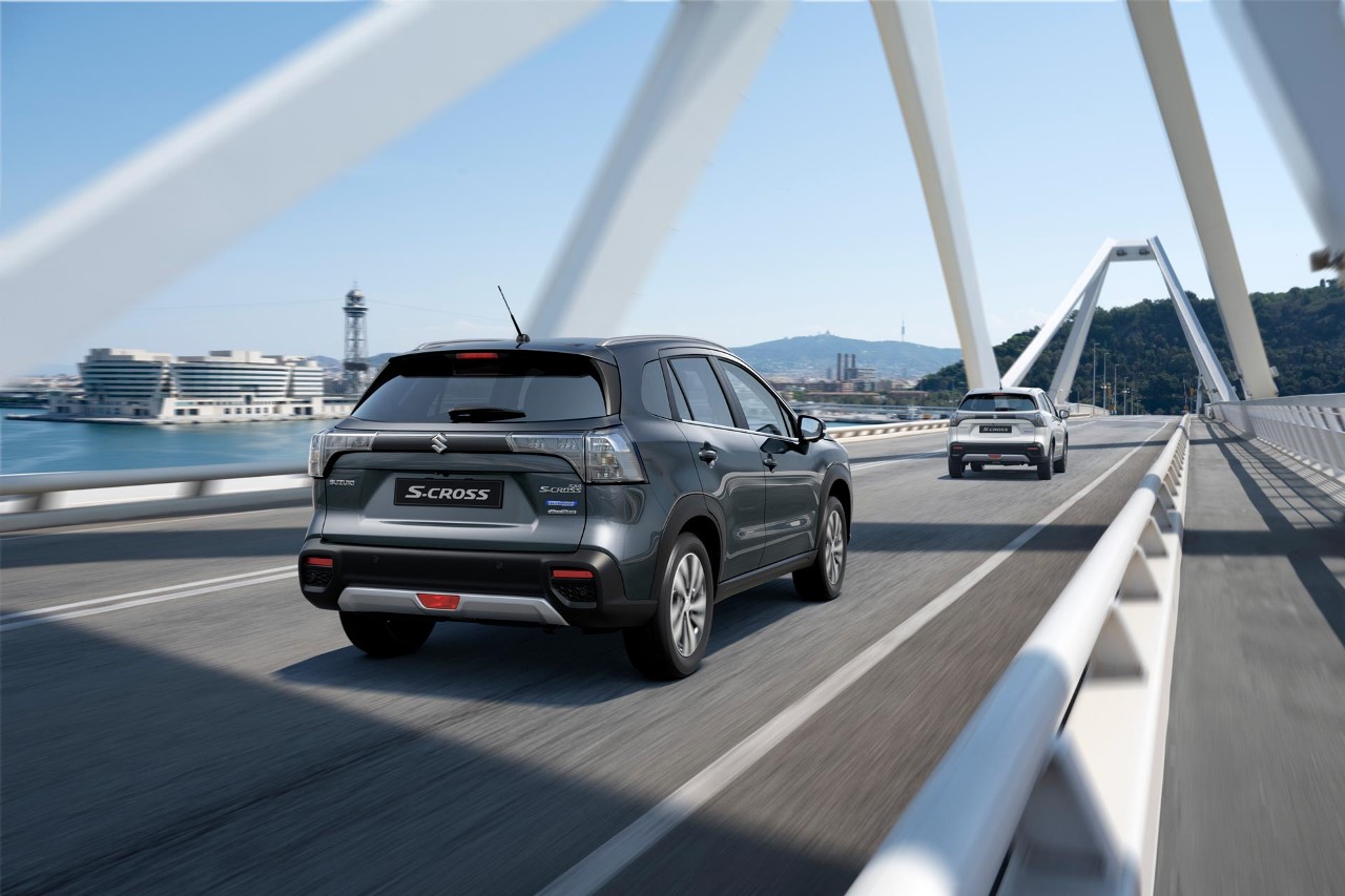 Suzuki S-Cross is driving on a bridge